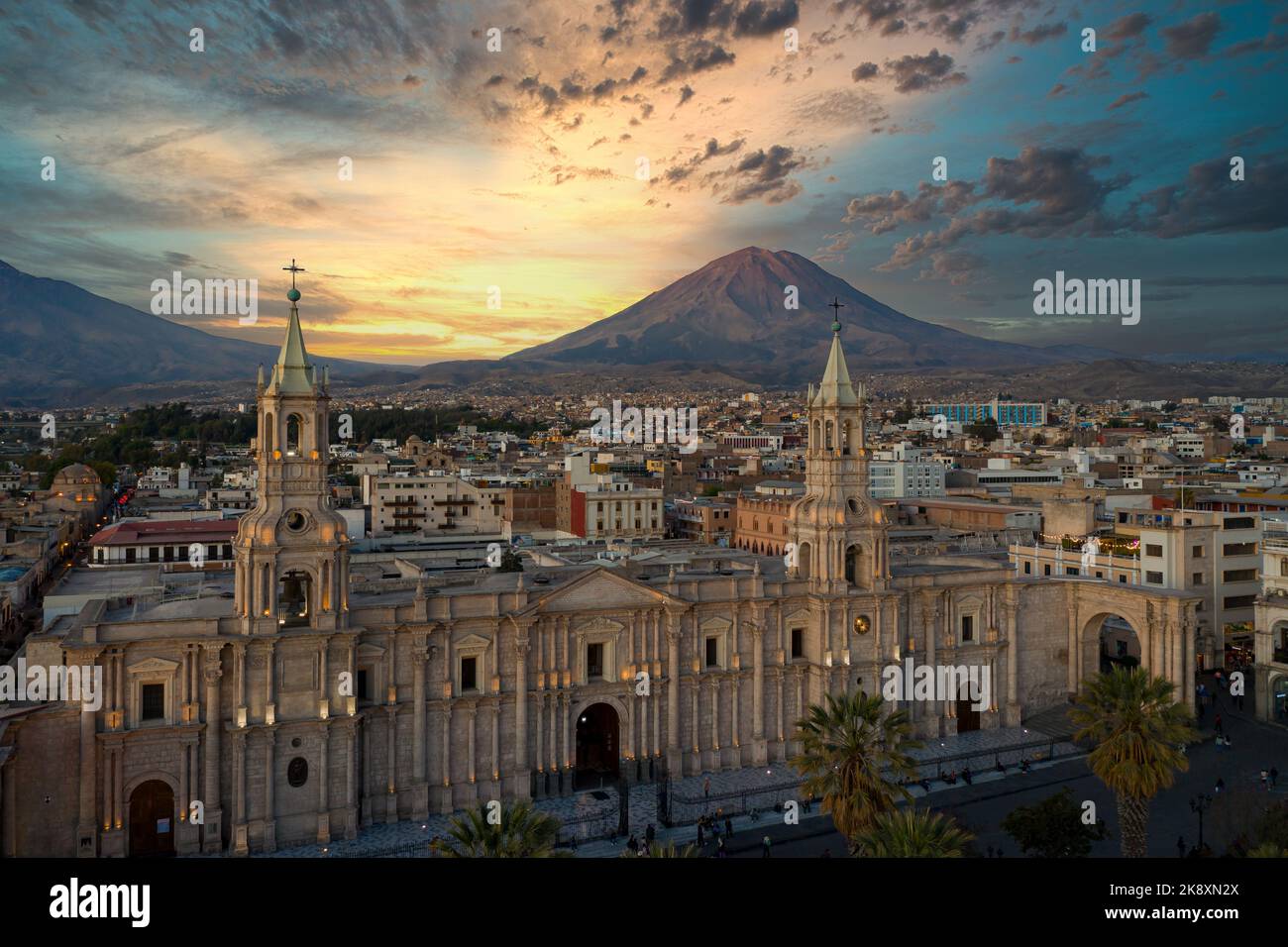 Aerial view of the Plaza de Armas with the Arequipa Cathedral and the Misti Volcano in the background in Arequipa, Peru at the blue hour/sunset. Stock Photo