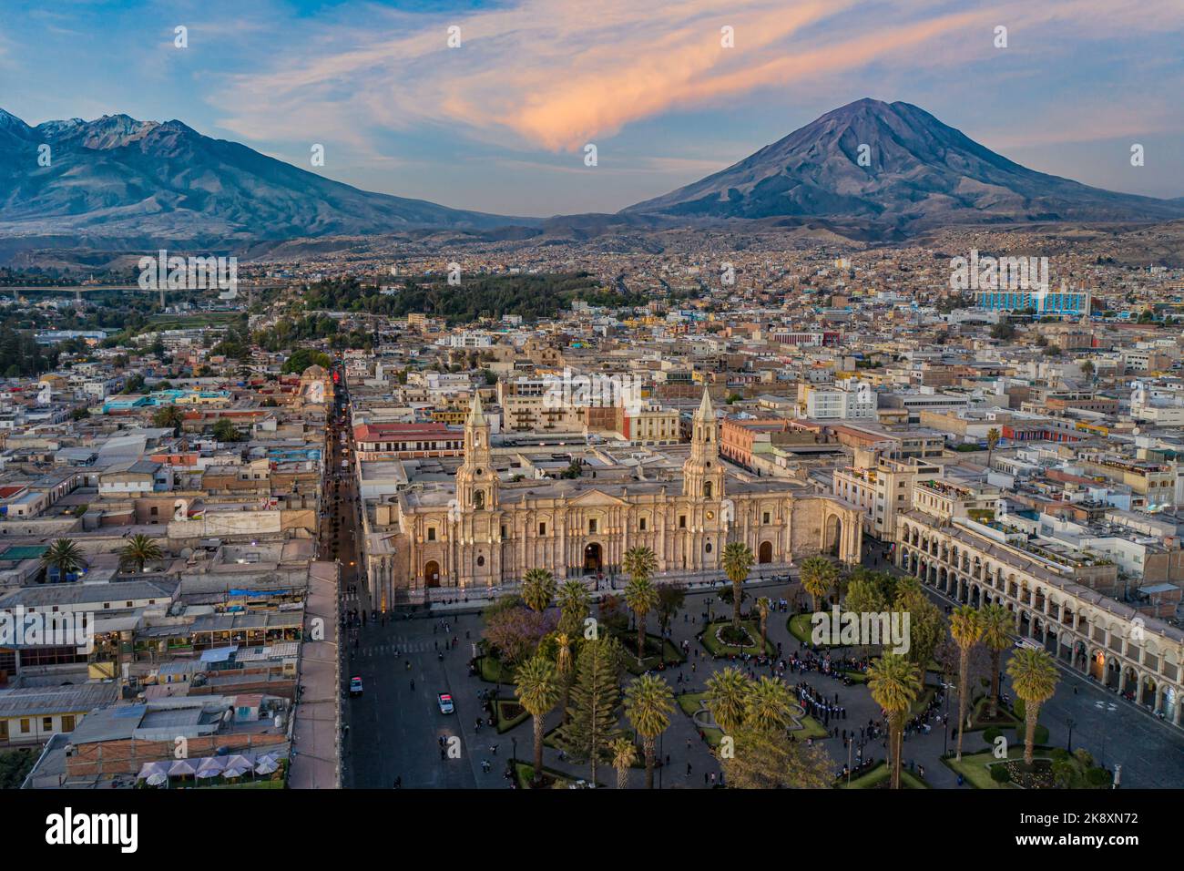 Drone shot of the Plaza de Armas with the Arequipa Cathedral and the Misti Volcano in the background in Peru at the blue hour/sunset Stock Photo