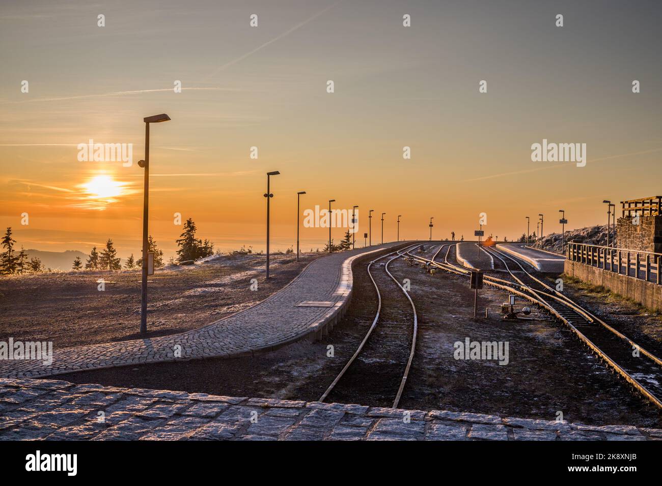 A beautiful sunset view in the background of an empty railroad Stock ...