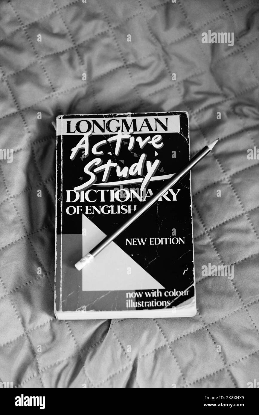 An old used Longman Active Study Dictionary Of English with a pencil on