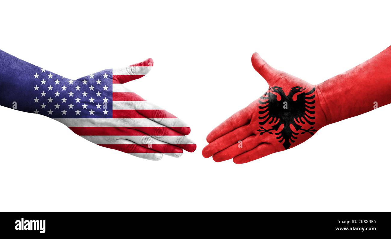 Handshake between Albania and USA flags painted on hands, isolated