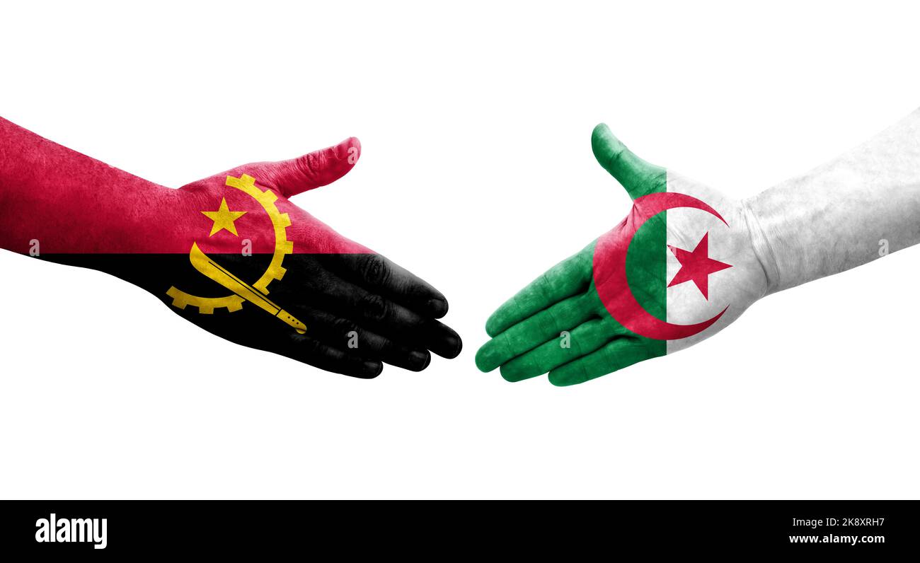 Handshake between Algeria and Angola flags painted on hands, isolated transparent image. Stock Photo