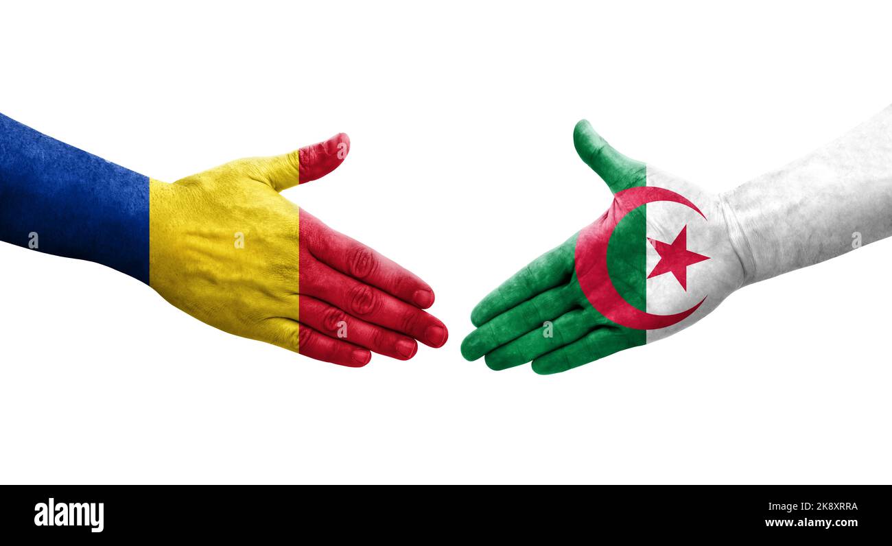 Handshake between Algeria and Romania flags painted on hands, isolated transparent image. Stock Photo