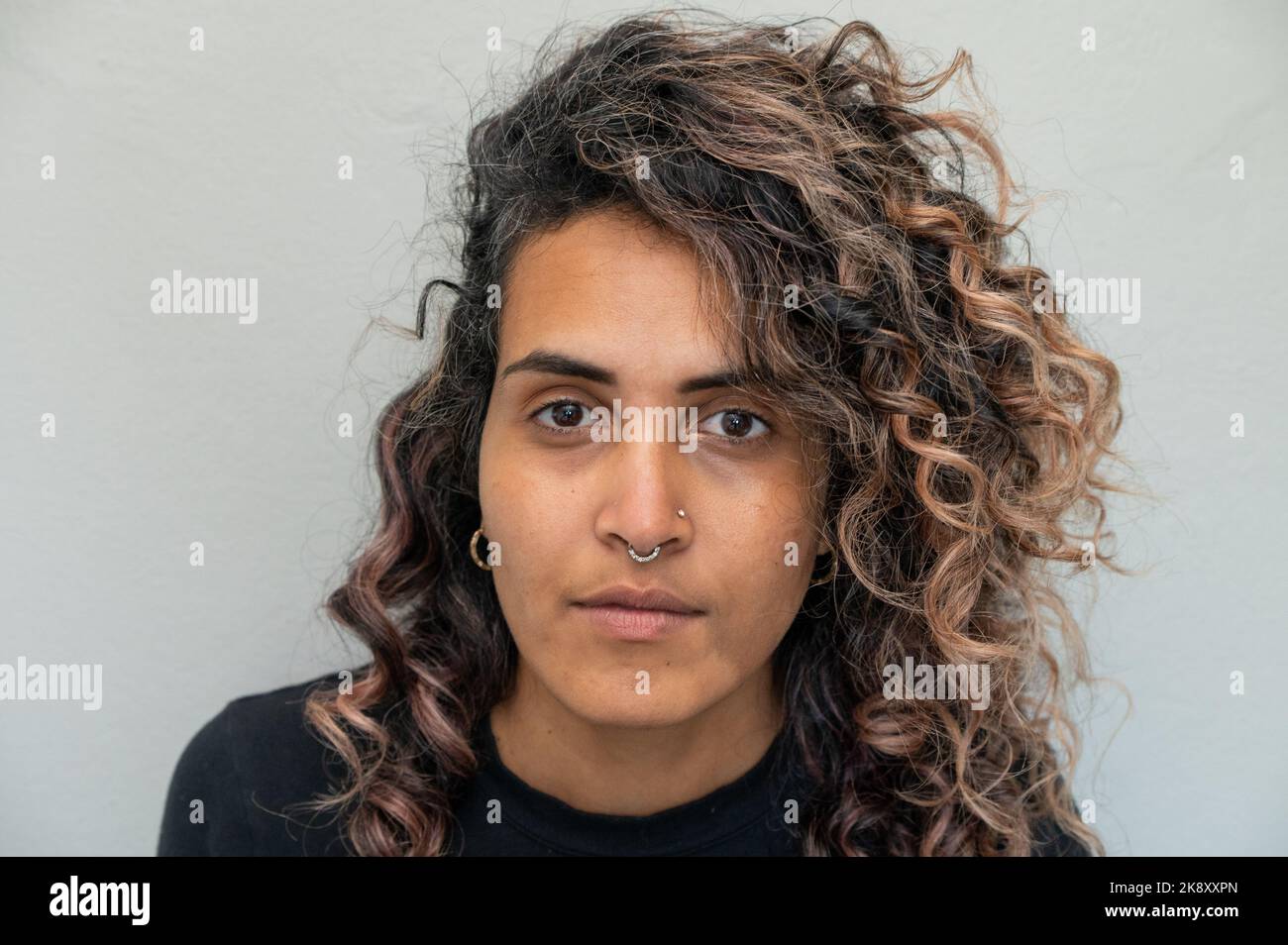 Beautiful woman curly brown hi-res stock photography and images - Alamy