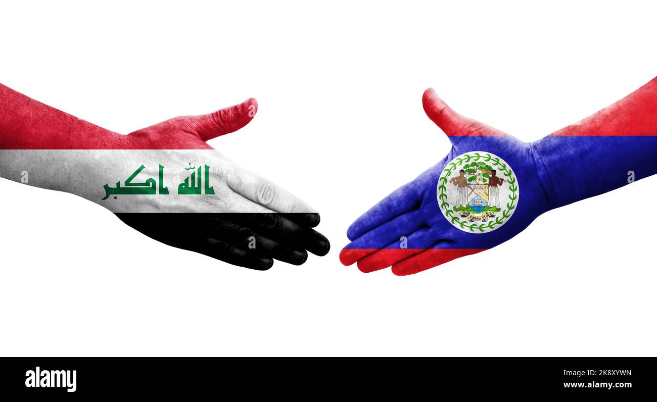 Handshake between Belize and Iraq flags painted on hands, isolated transparent image. Stock Photo