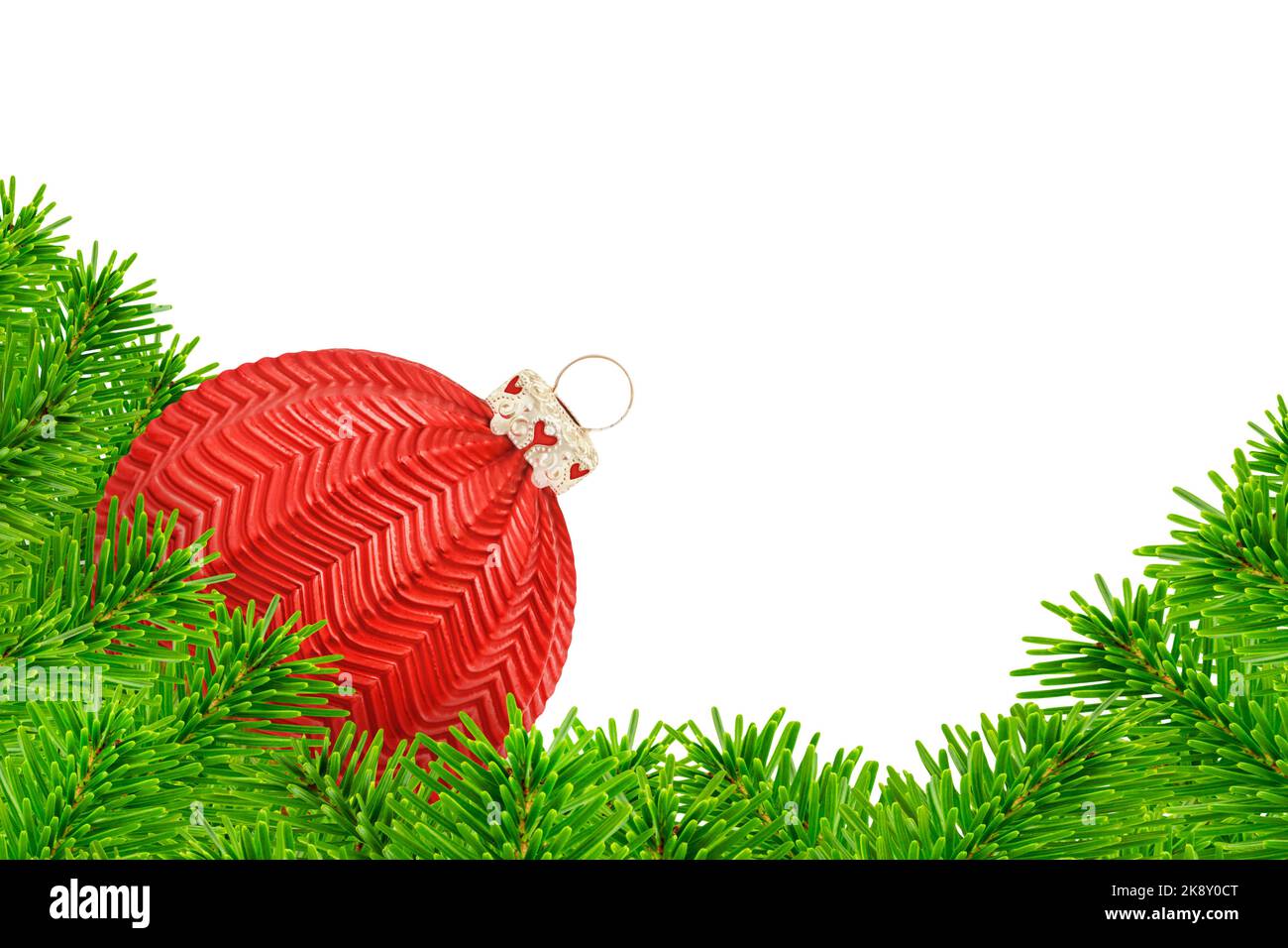 Christmas decoration with fir branches and red ball isolated on white ...