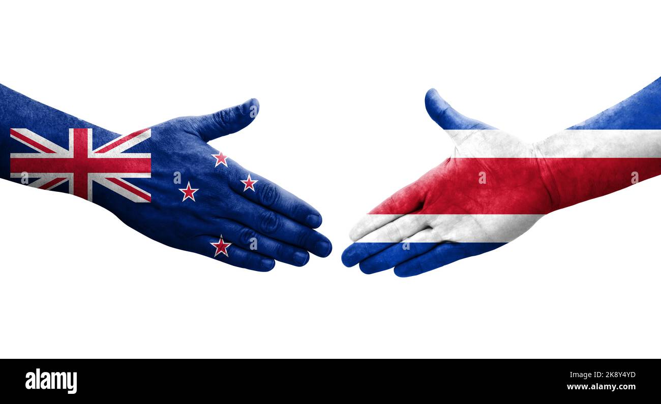 Handshake between Costa Rica and New Zealand flags painted on hands
