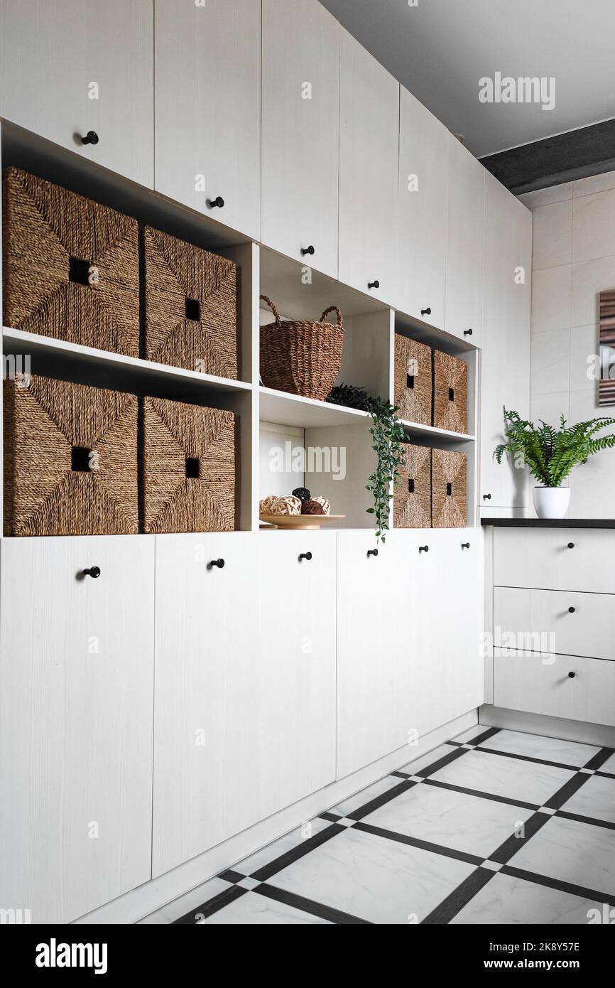 Interior design, storage unit with wicker baskets Stock Photo Alamy