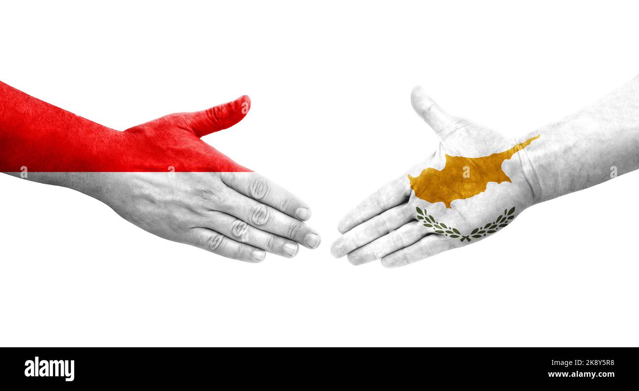 Handshake between Cyprus and Indonesia flags painted on hands, isolated ...