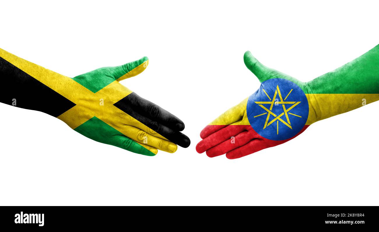 Handshake between Ethiopia and Jamaica flags painted on hands, isolated