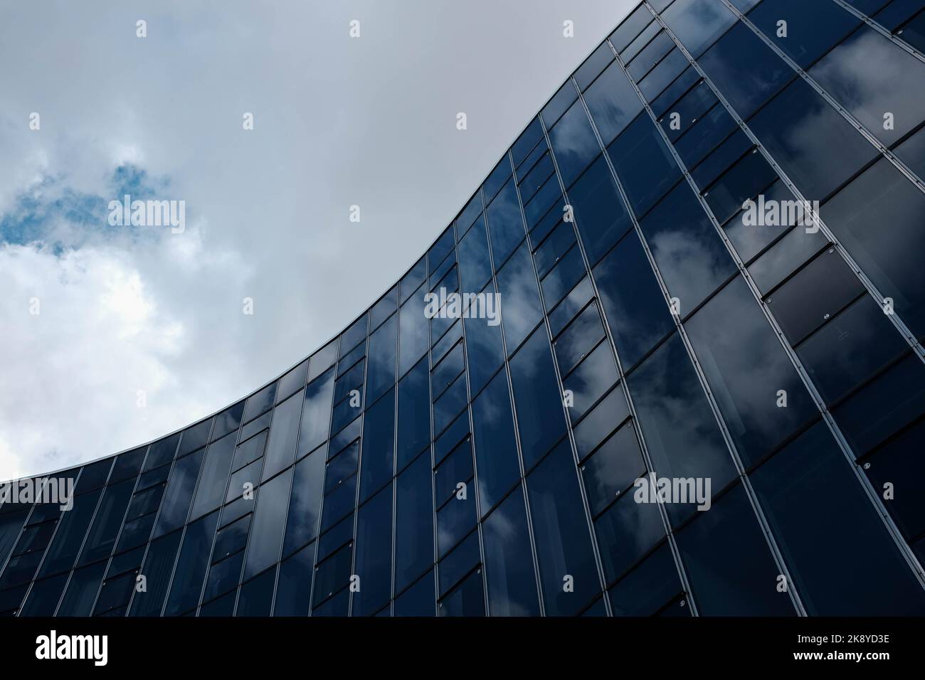 A low angle shot of glass building facade of Headquarters of the French Communist Party Stock Photo