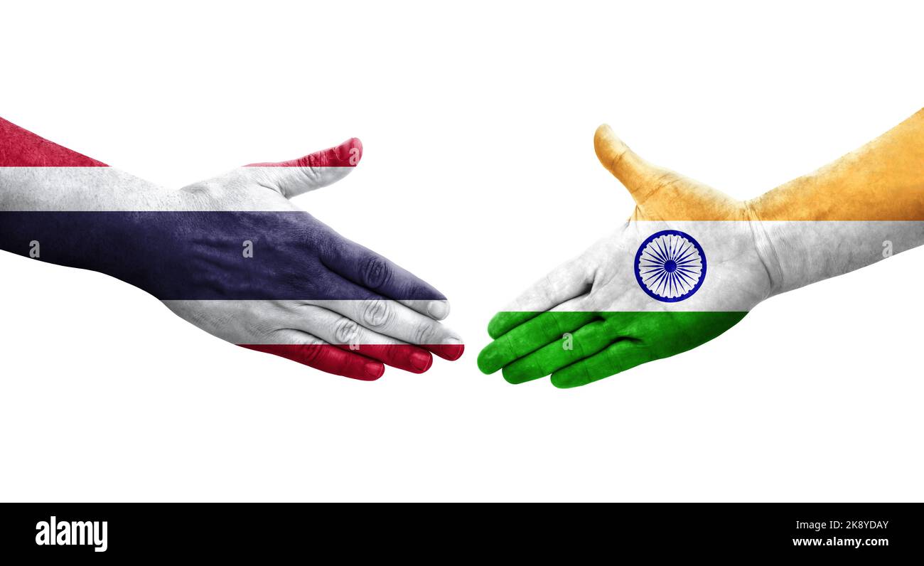 Handshake between India and Thailand flags painted on hands, isolated