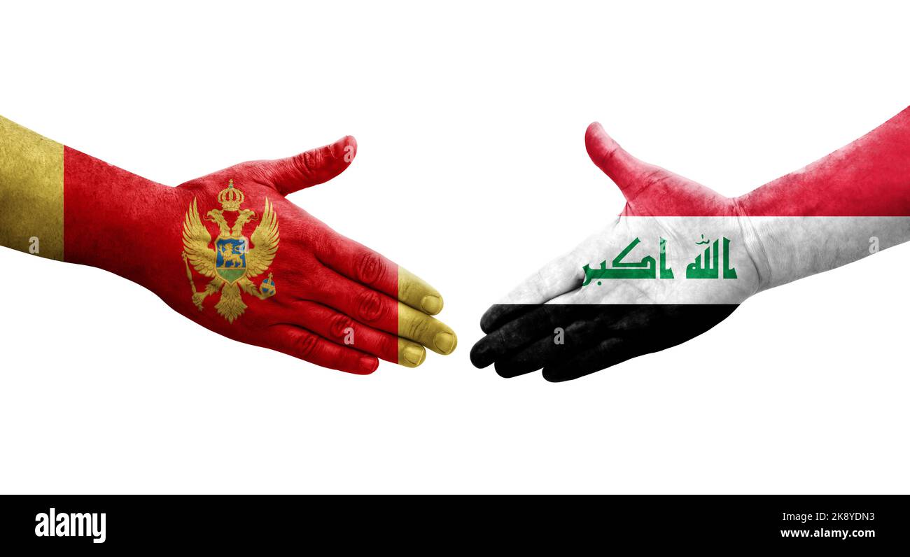 Handshake between Iraq and Montenegro flags painted on hands, isolated transparent image. Stock Photo