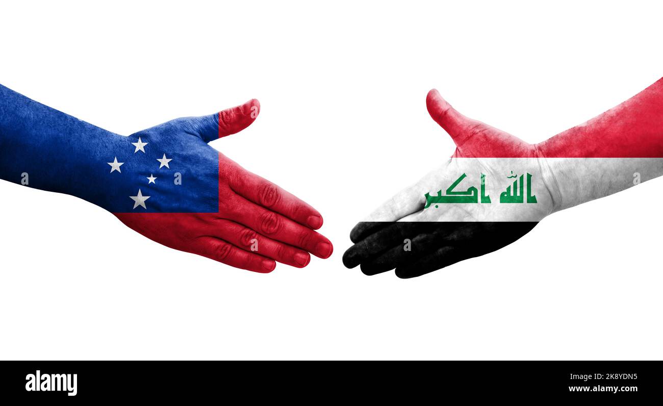 Handshake between Iraq and Samoa flags painted on hands, isolated transparent image. Stock Photo