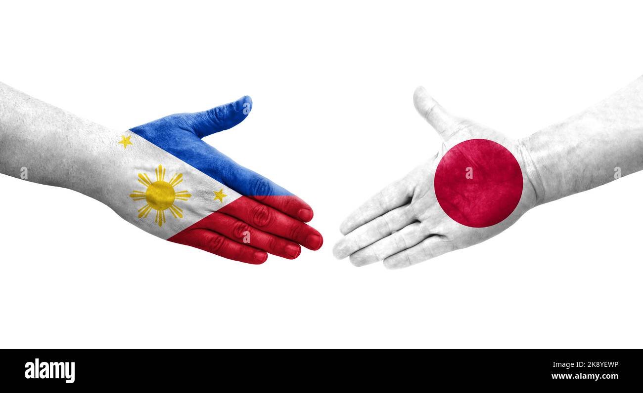 Handshake between Japan and Philippines flags painted on hands