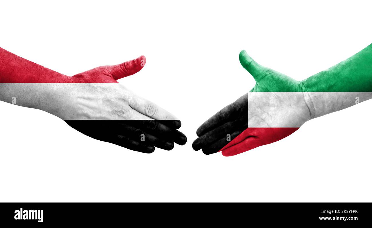 Handshake between Kuwait and Yemen flags painted on hands, isolated
