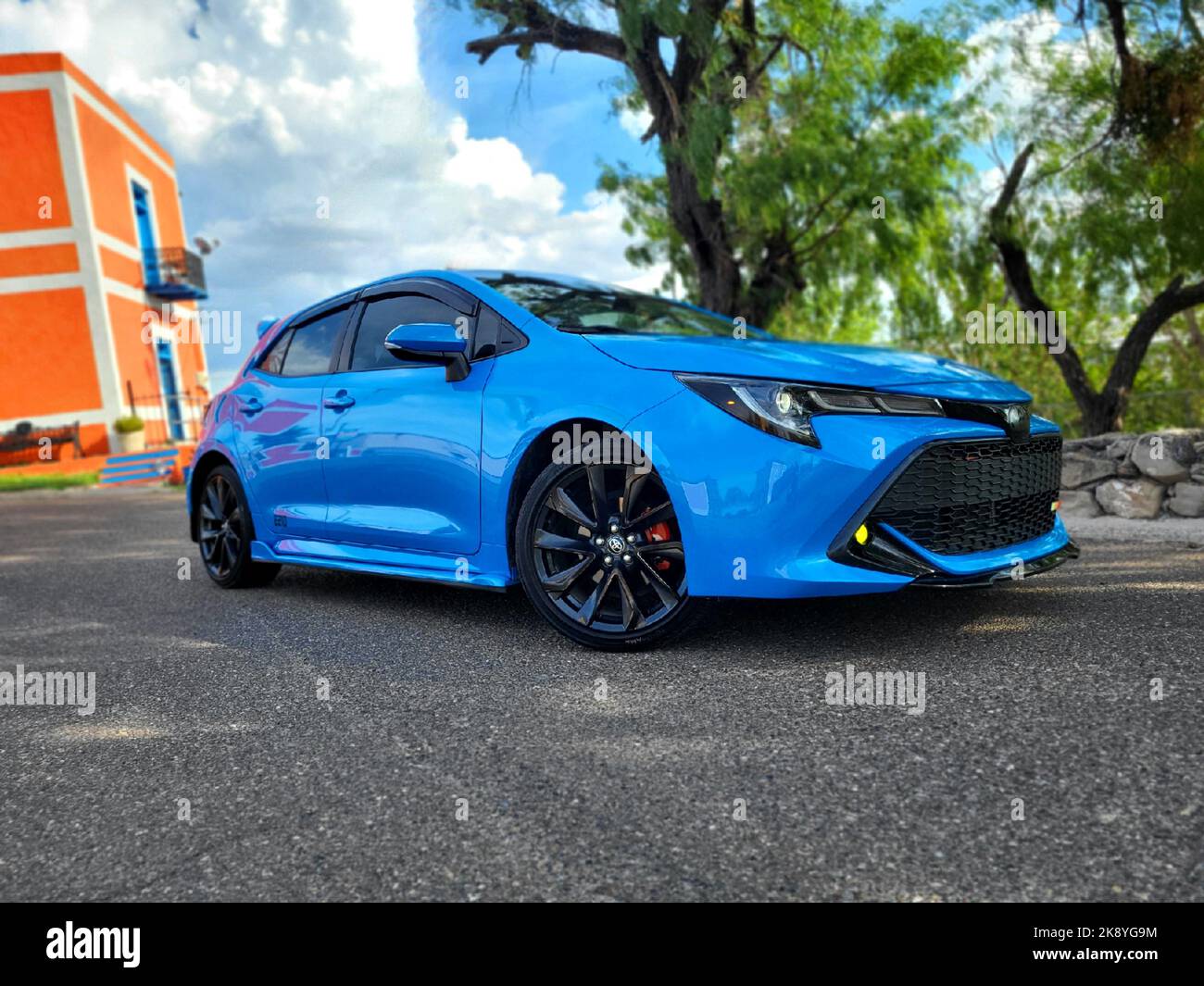 A blue Toyota Corolla hatchback parked on the street in Roma, USA Stock