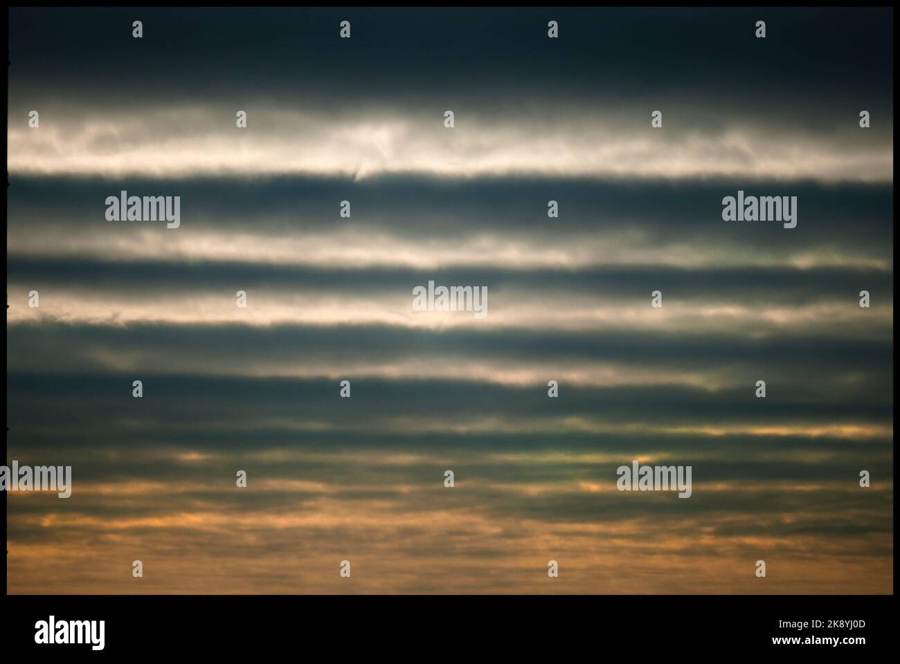 A dark, cloudy sky with layered clouds Stock Photo - Alamy