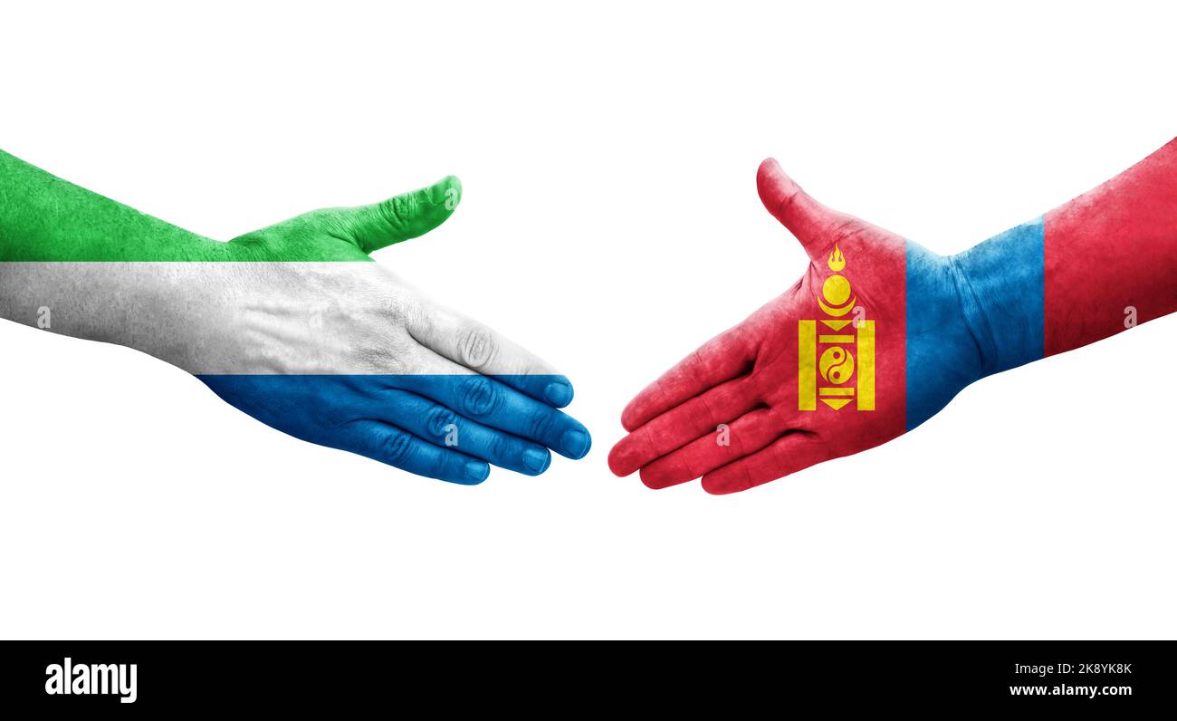 Handshake between Mongolia and Sierra Leone flags painted on hands, isolated transparent image. Stock Photo