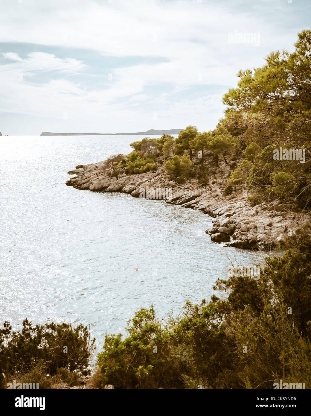 A vertical shot of a bay at the rocky seashore Stock Photo - Alamy