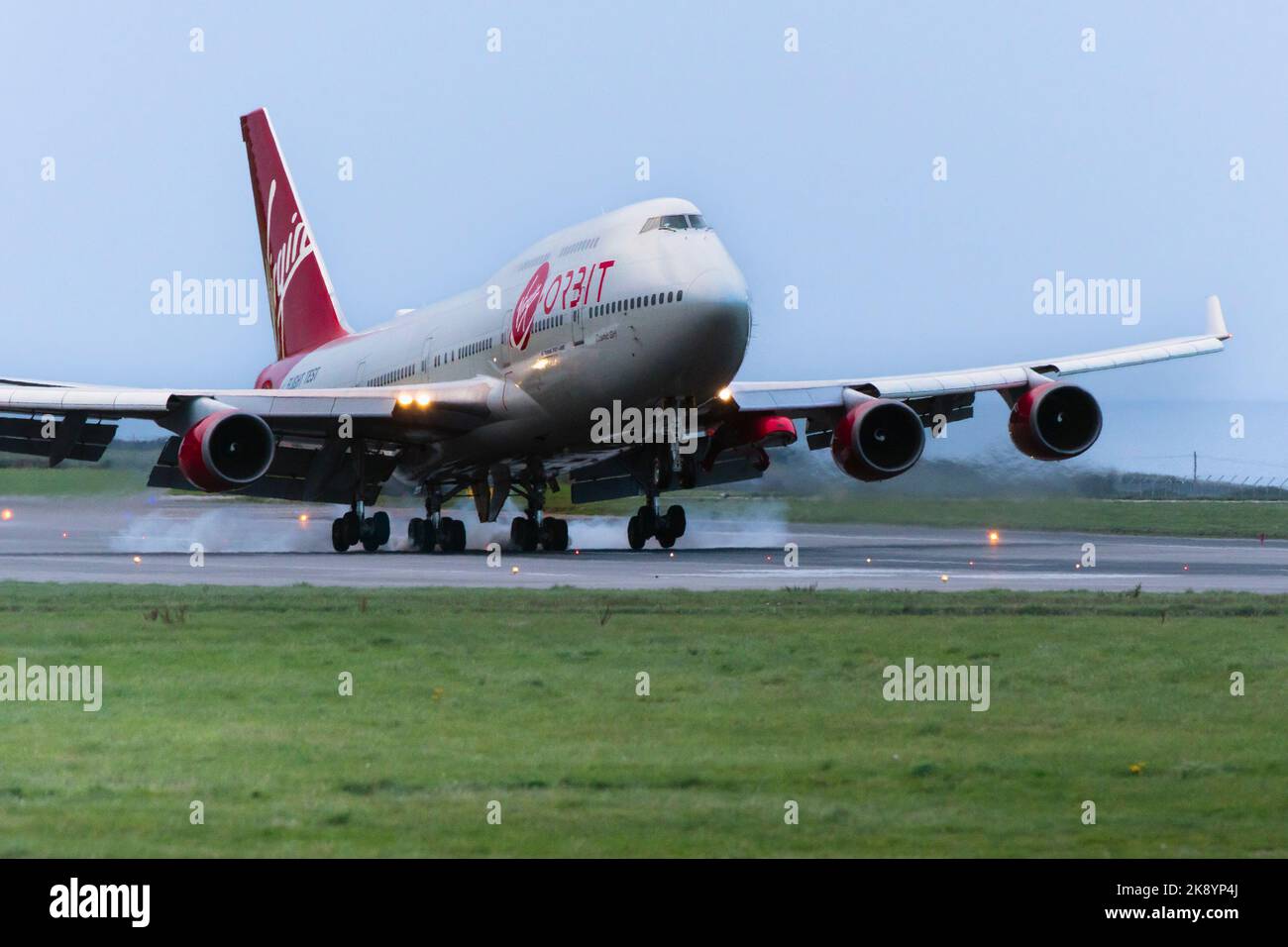 Touch down.  The long awaited arrival of the Virgin Orbit, Cosmic Girl, a 747-400 converted to a rocket launch platform at the Spaceport Cornwall in N Stock Photo