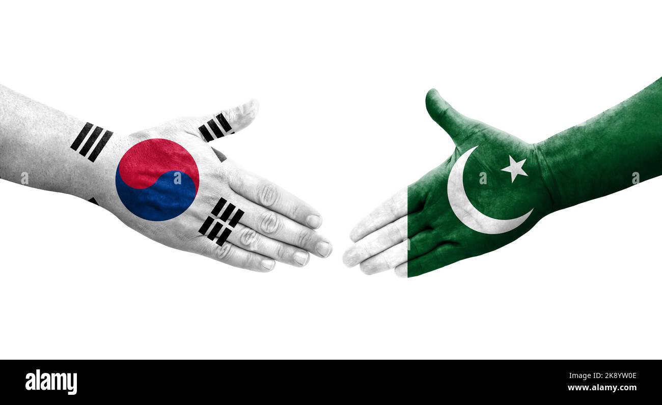 Handshake between South Korea and Pakistan flags painted on hands