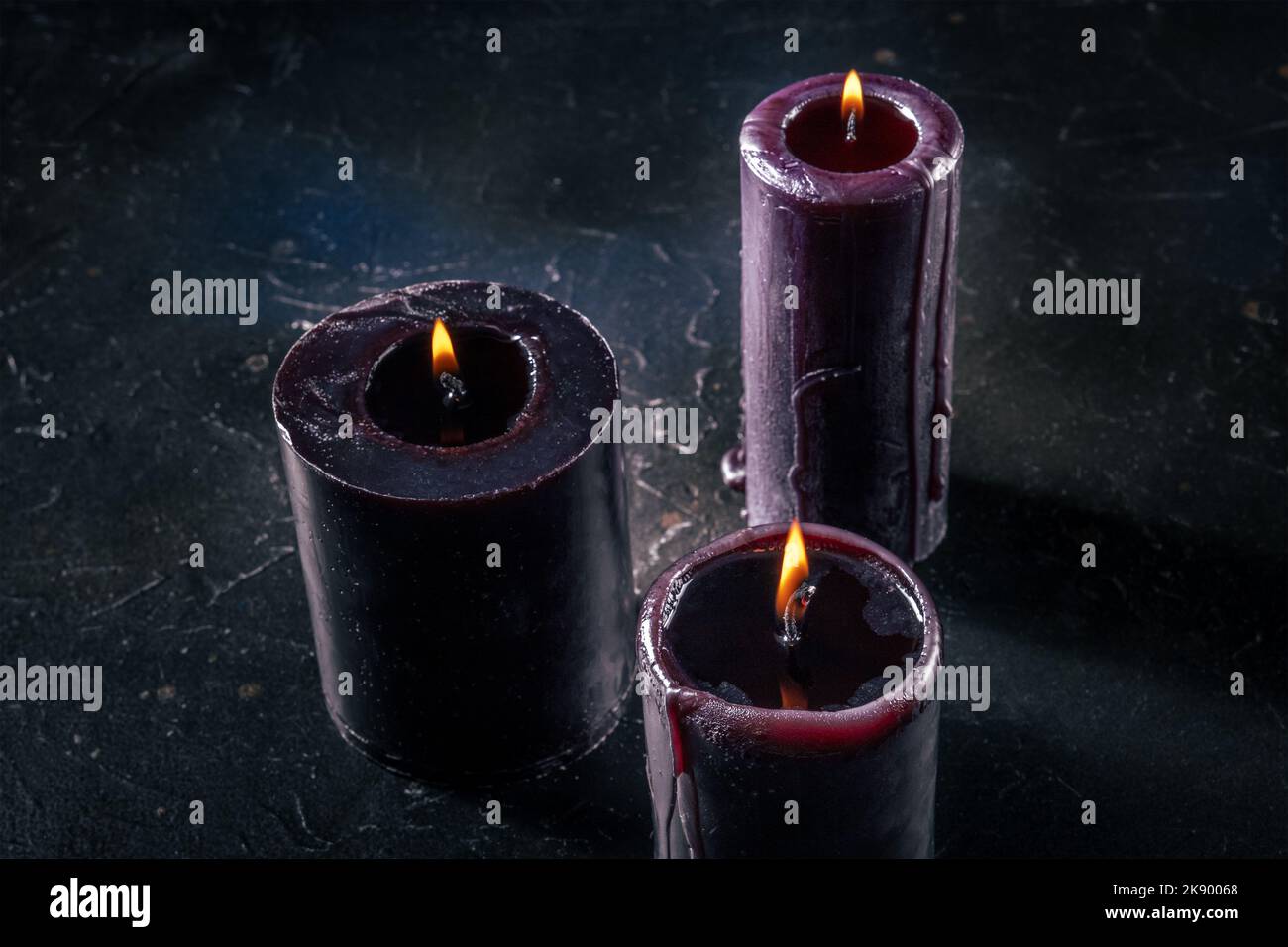 Burning candles on a dark background, mysterious ritual Stock Photo - Alamy