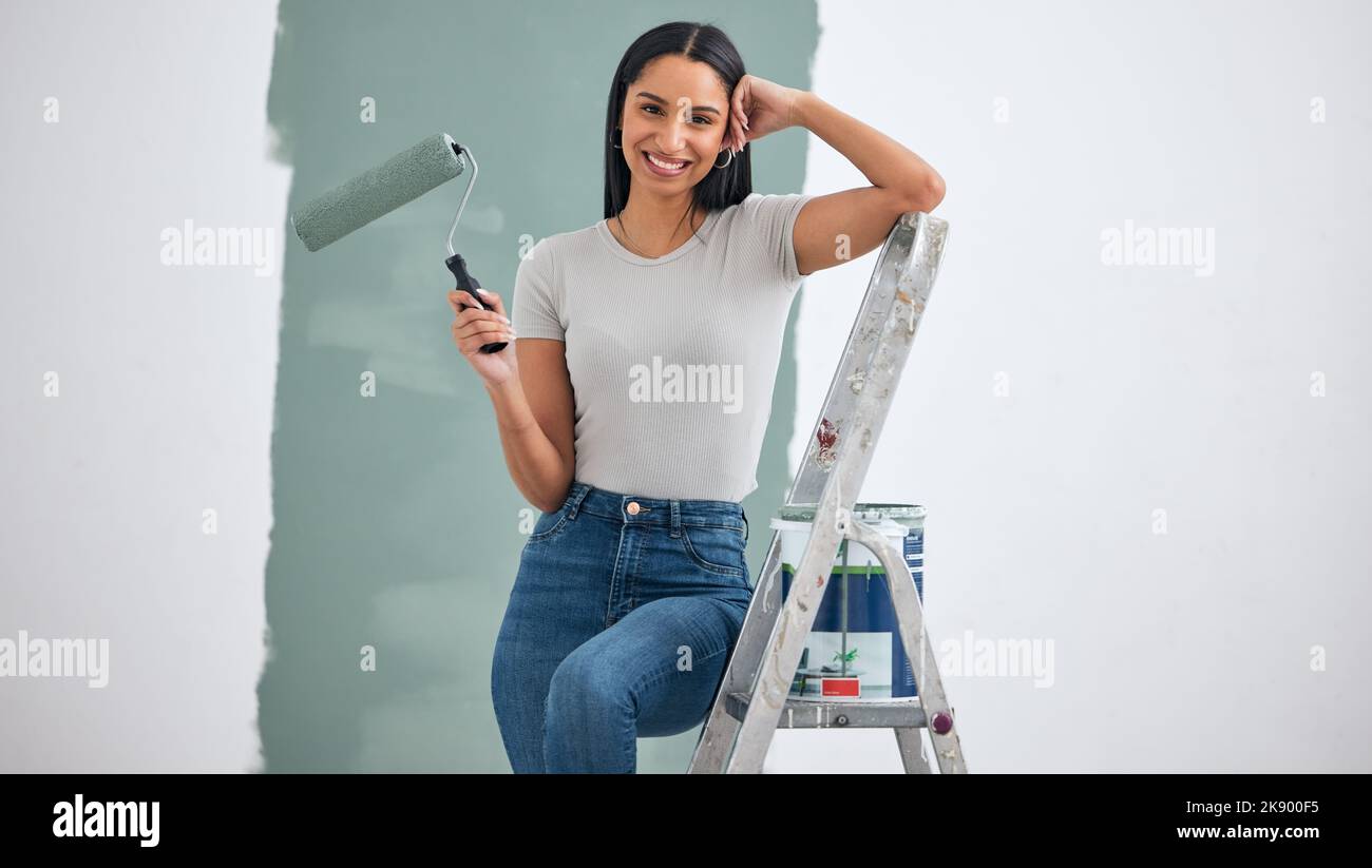 Paint, wall and woman with color choice in portrait for home renovation, room interior or creative hardware project inspiration. Happy woman painter Stock Photo