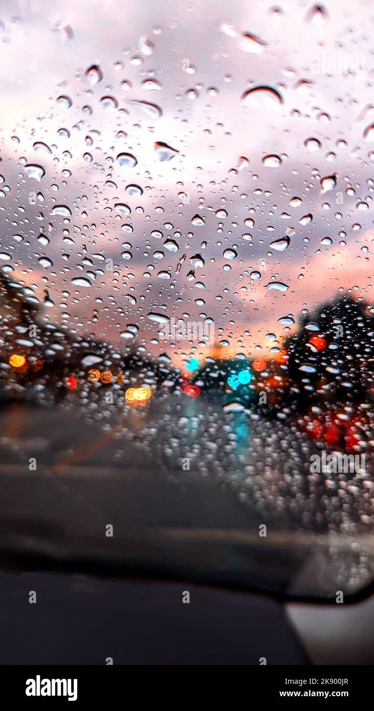 A vertical shot of the raindrops on the car window Stock Photo - Alamy