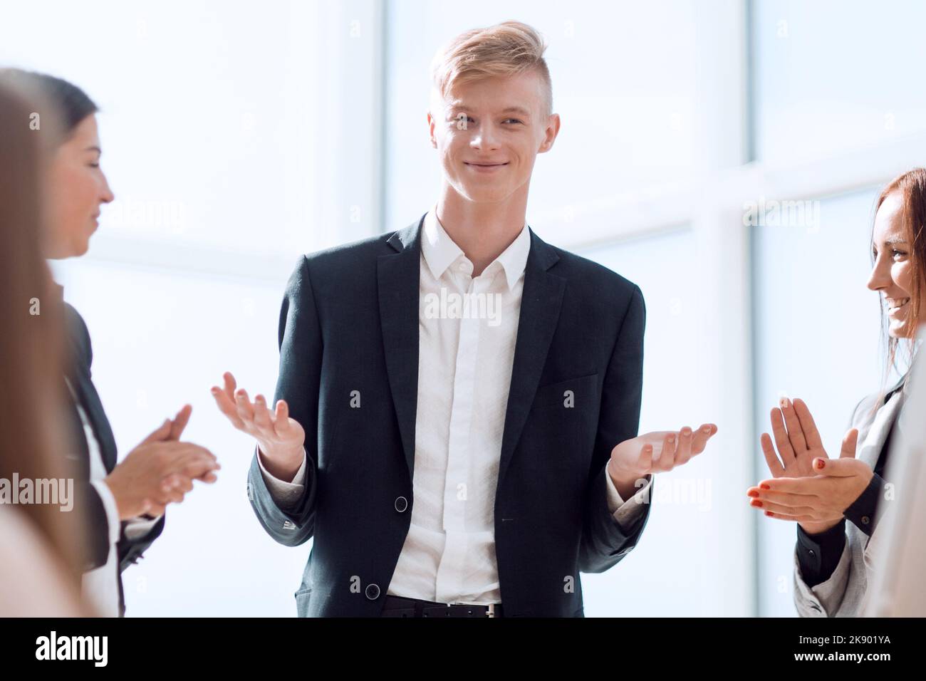 happy leader standing in front of his business team Stock Photo - Alamy