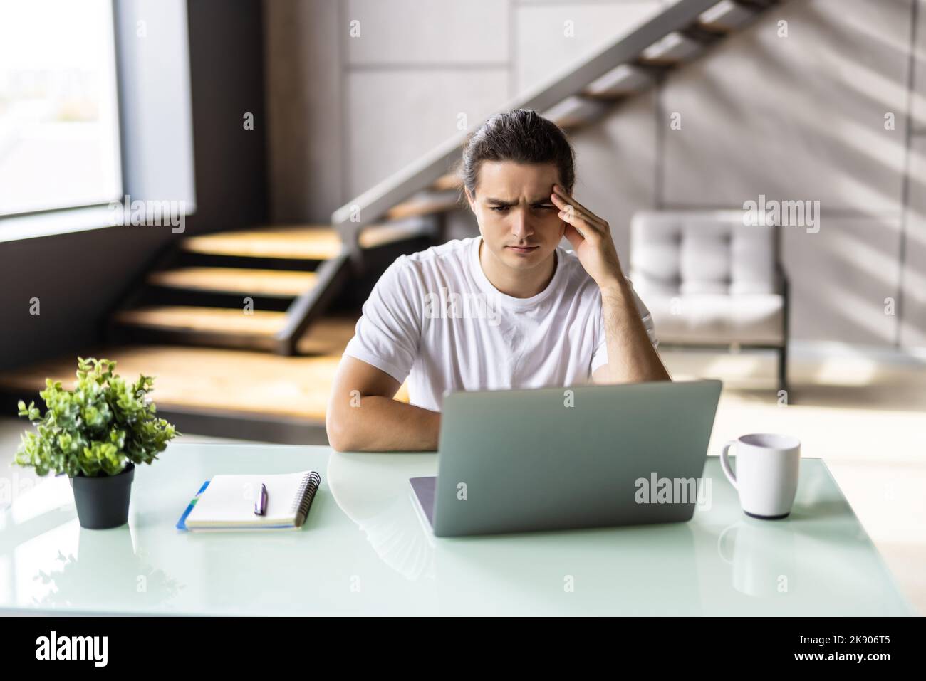 Tired young man feel pain eyestrain holding rubbing dry irritated eyes