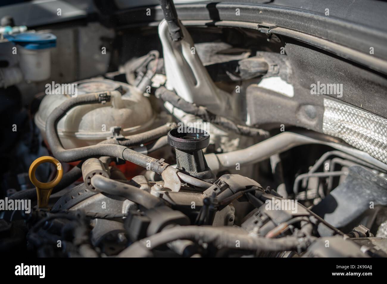 Motor oil reservoir under the hood Stock Photo Alamy