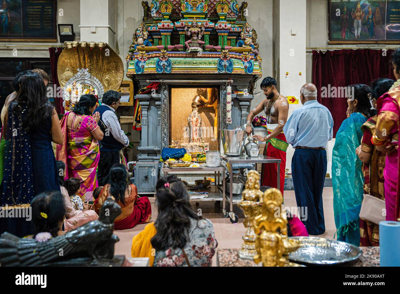 A pandit or Hindu priest performs Abhishekam puja, a Hindu ritual of