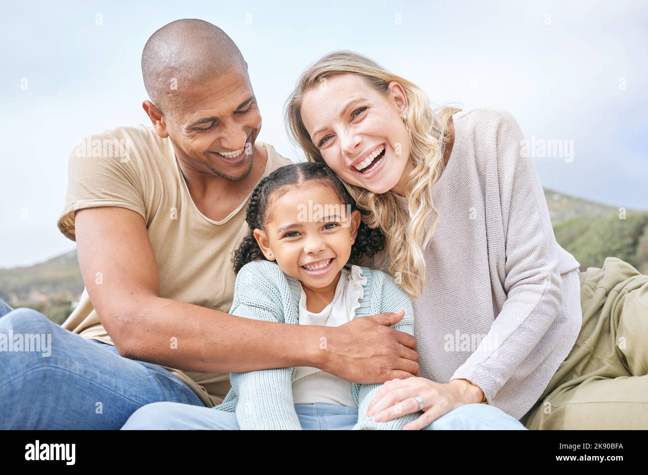 Happy, family relax and portrait in nature on vacation, holiday or ...