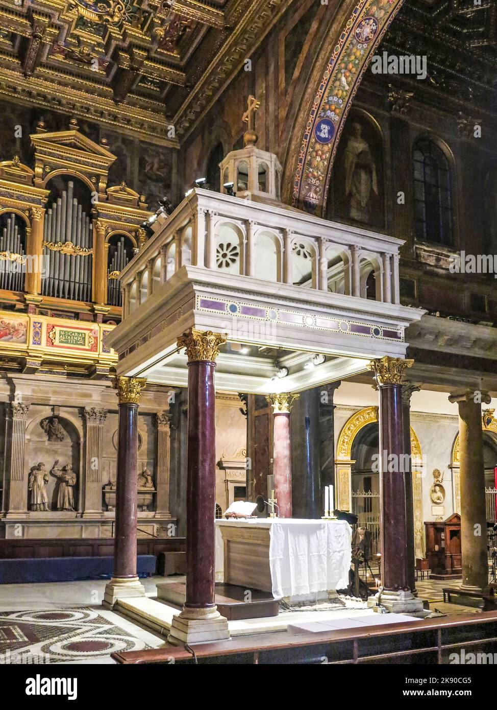 ROME, ITALY, DEC 23, 2015 : Altar space of the ancient basilica of Santa Maria in Trastevere, with ancient gilded mosaics. Stock Photo