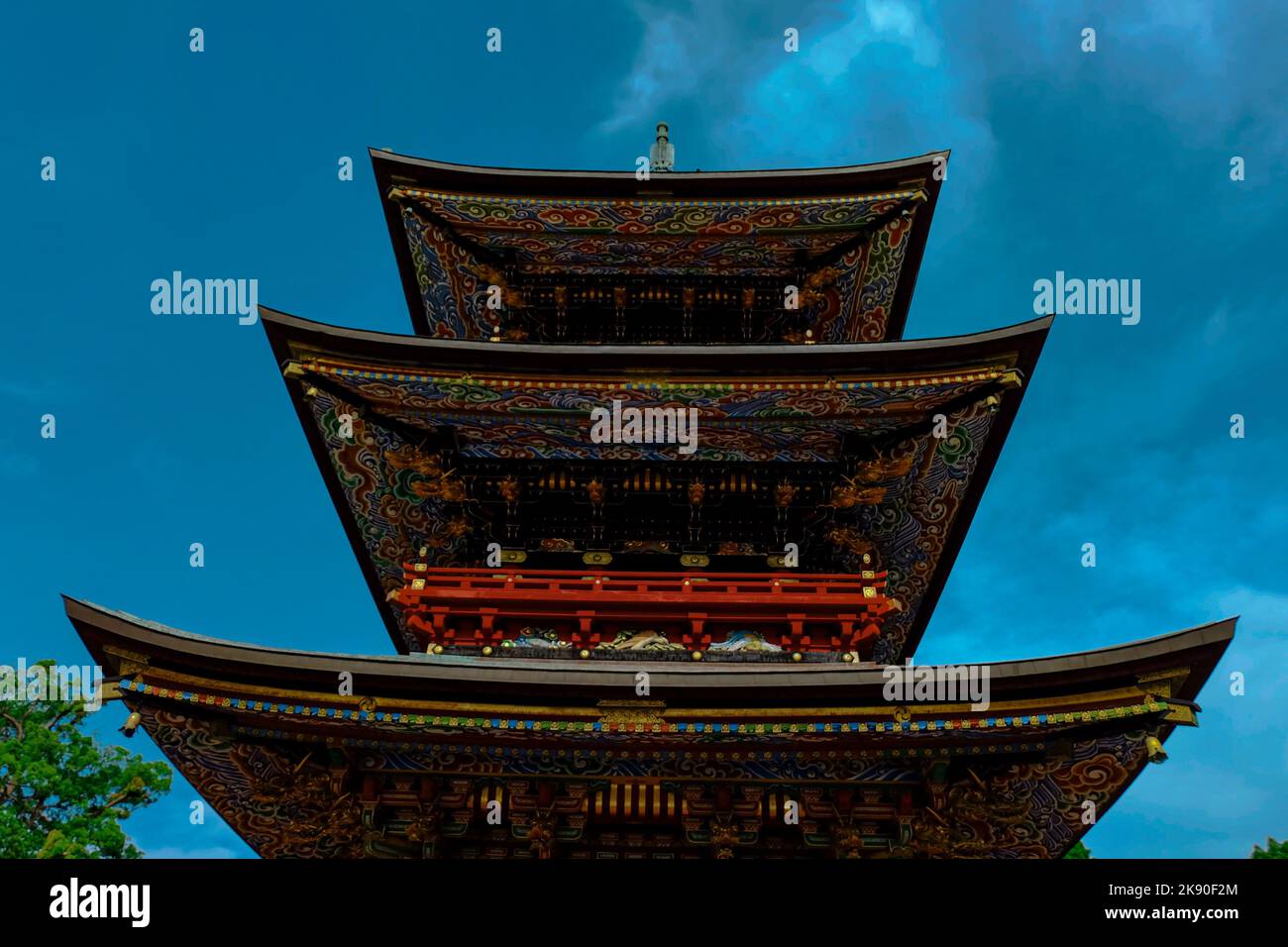 A low angle of a Threestory Pagoda in Narita Temple, Japan with a blue