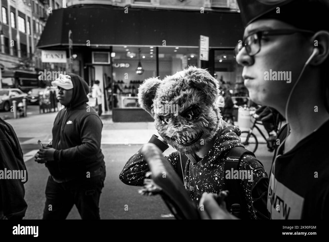A black and white shot of people in costumes during Halloween, New York Stock Photo