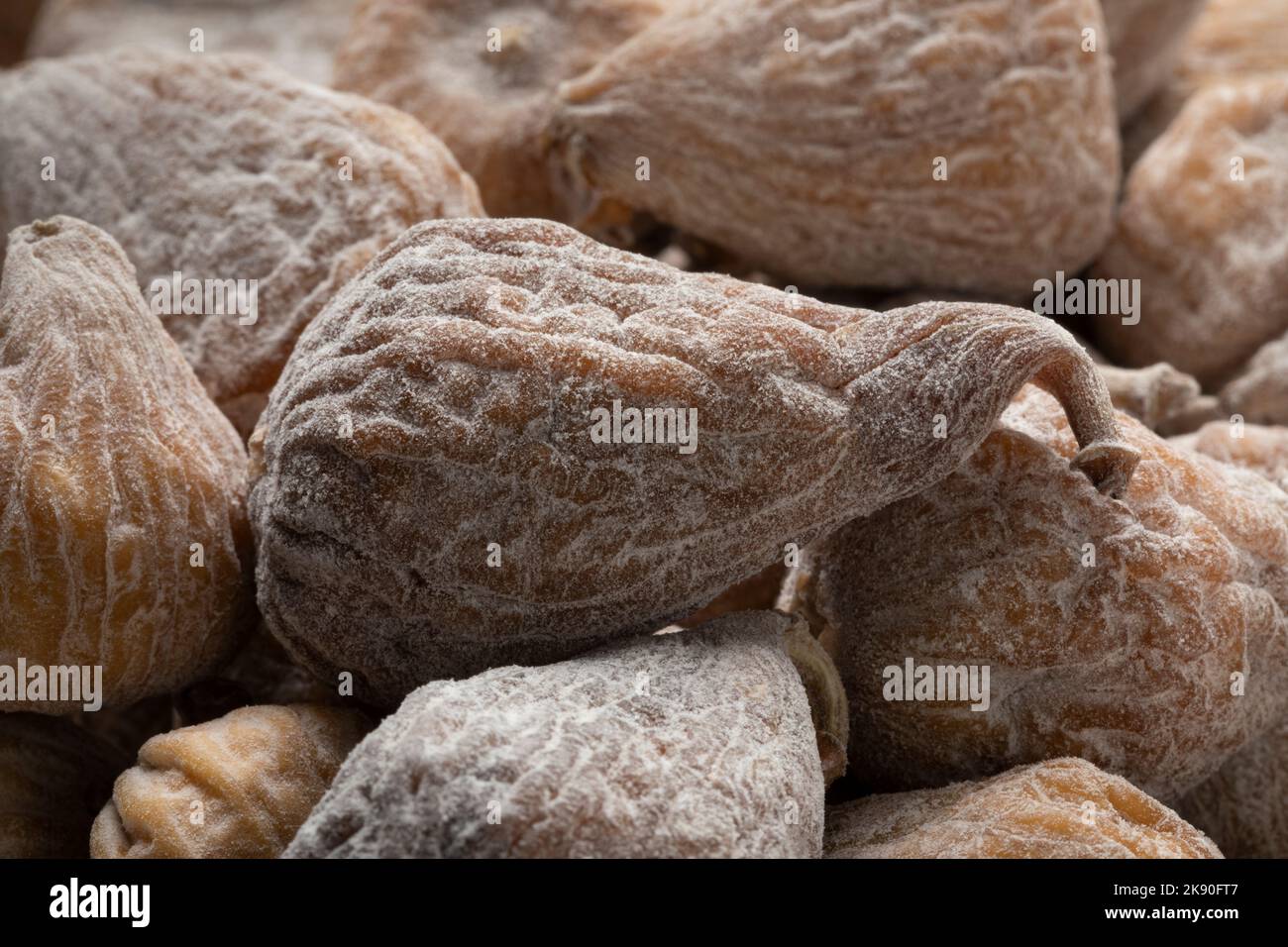 Sweet dried small spanish figs close up full frame as background Stock Photo