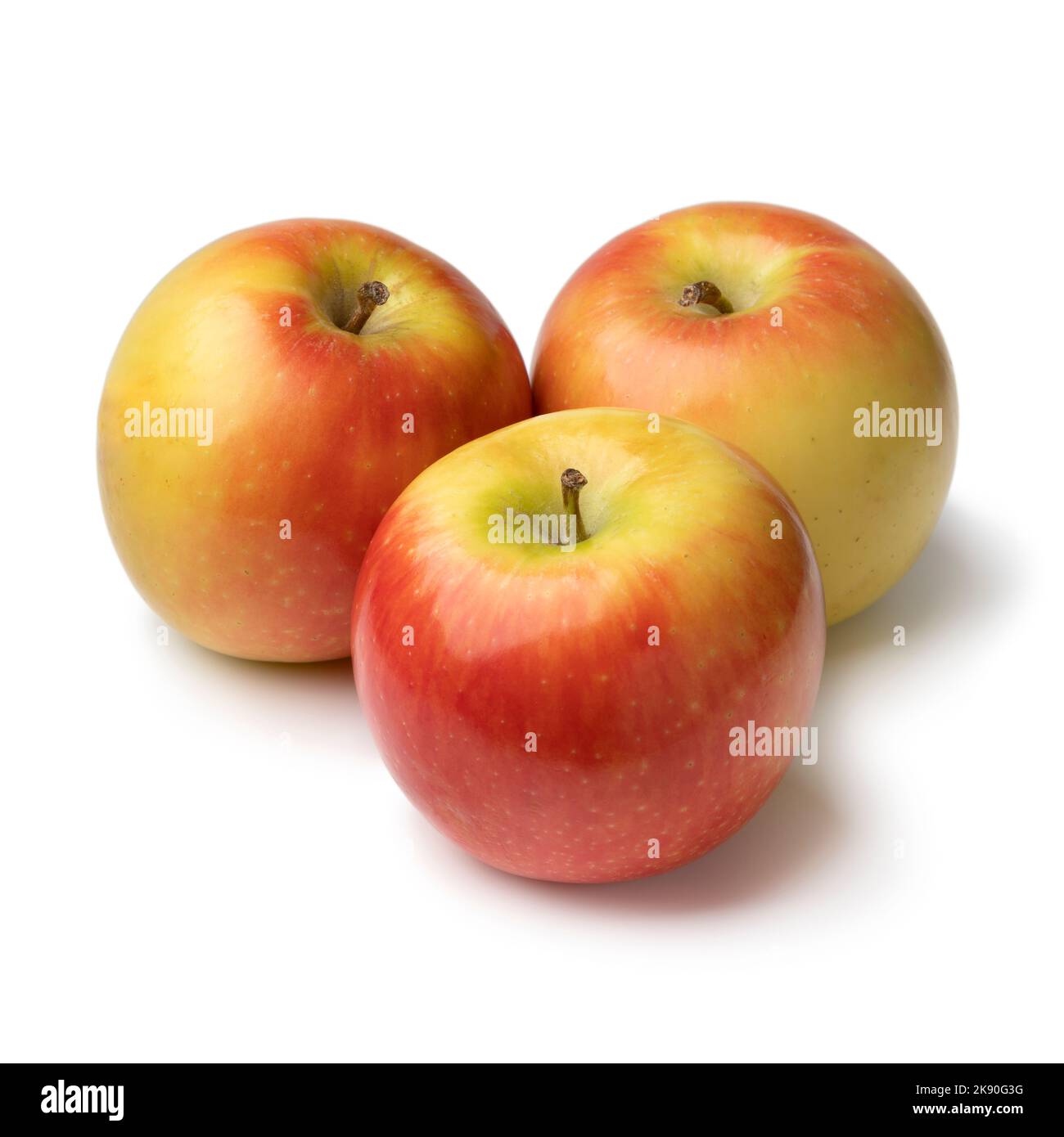 Three whole fresh ripe Kanzi apples isolated on white background Stock