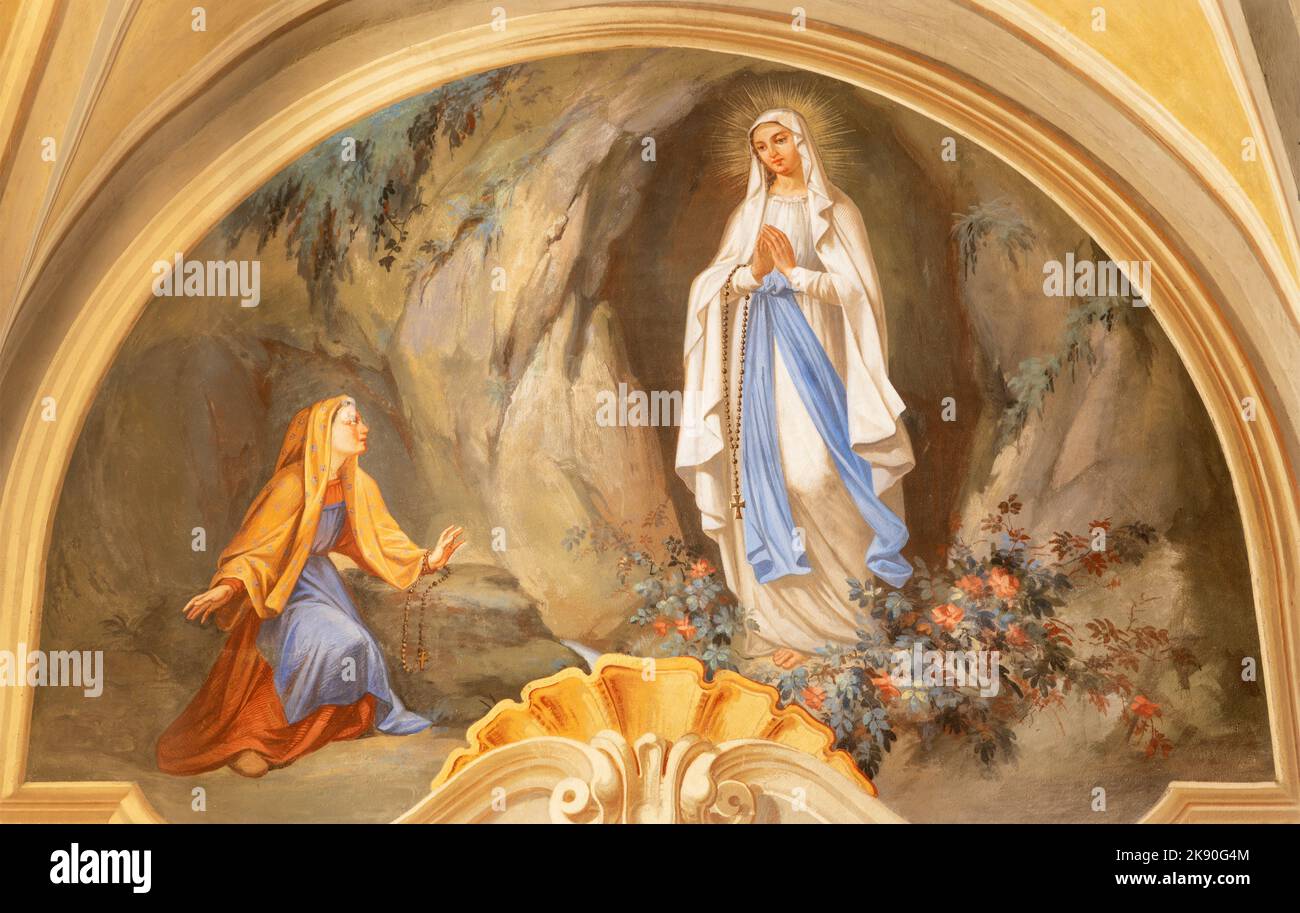 COURMAYEUR, ITALY - JULY 12, 2022: The fresco of apparition of Virgin Mary in Lourdes in church Chiesa di San Pantaleone by Nino Pirlato (1957). Stock Photo