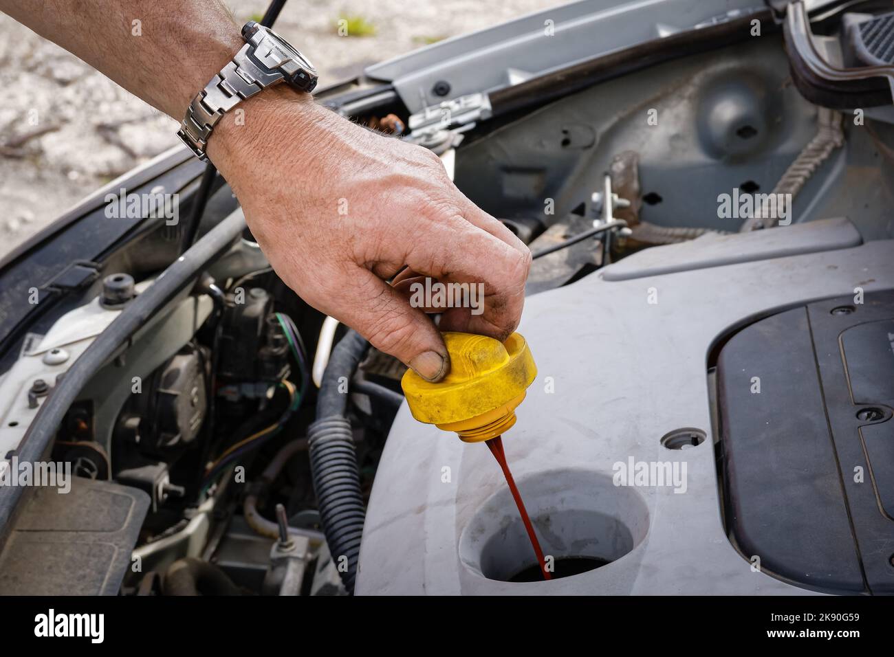 A closeup shot of a mechanic fixing his car outdoors Stock Photo - Alamy