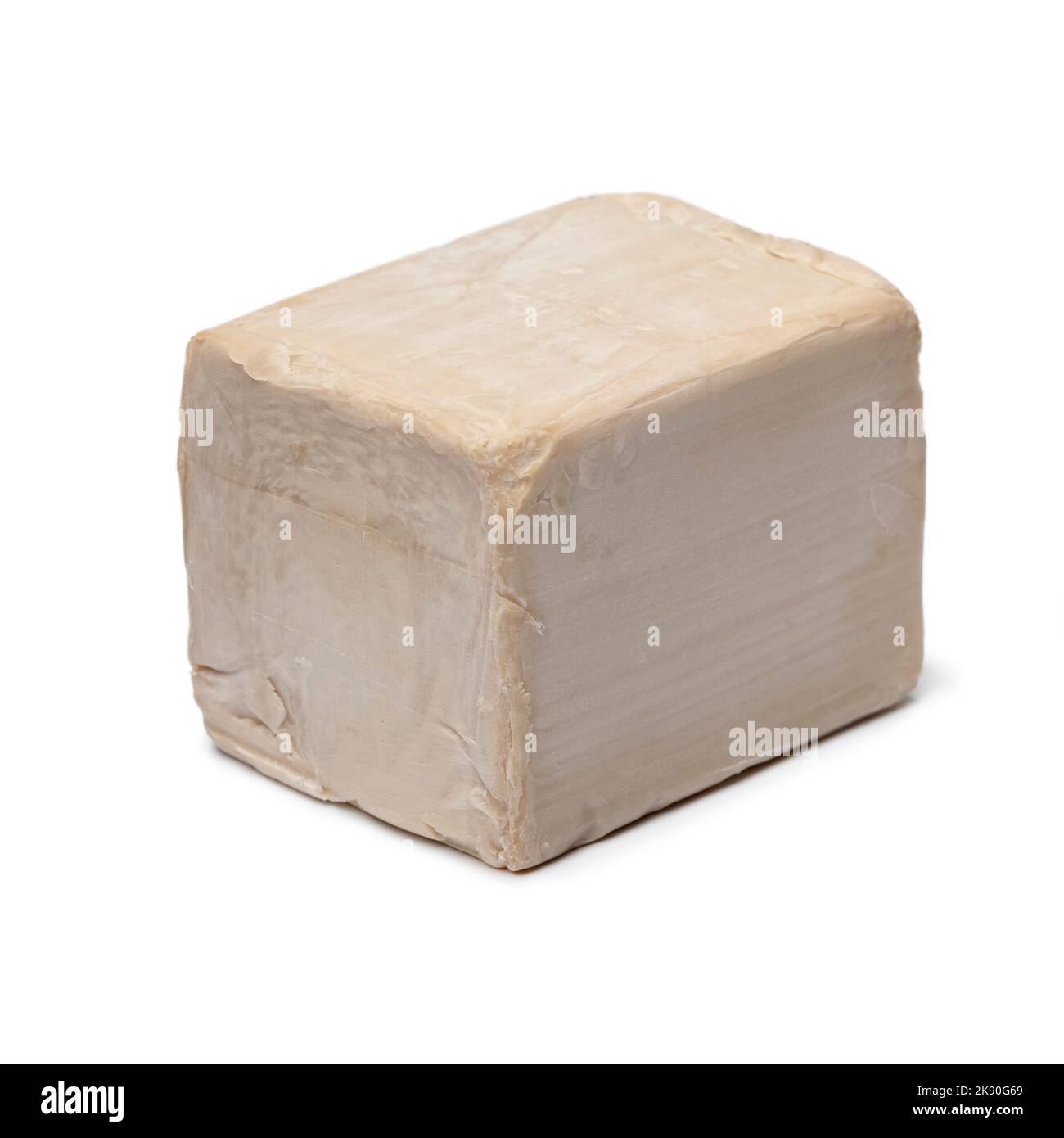 Single fresh yeast cube isolated on white background close up Stock Photo