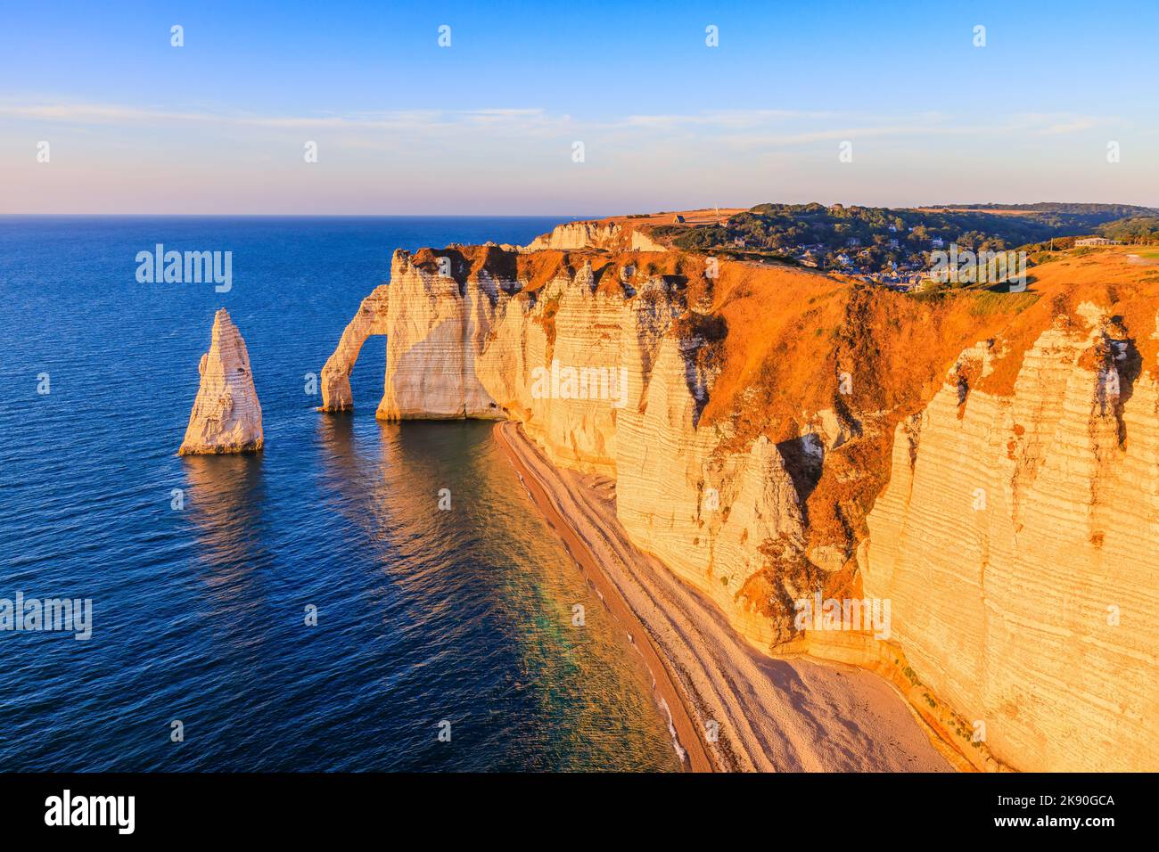 Normandy, France. Etretat village cliffs with the Porte d'Aval arch and the rock known as the Aiguille d'Etretat. Stock Photo