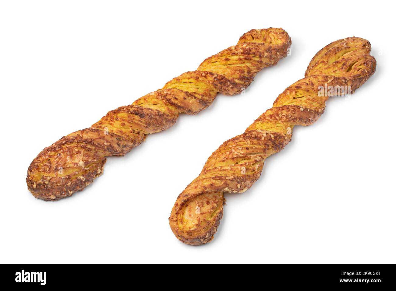 Pair of Kaasstengels, a Dutch cheese snack in the shape of a stick isolated on white background Stock Photo