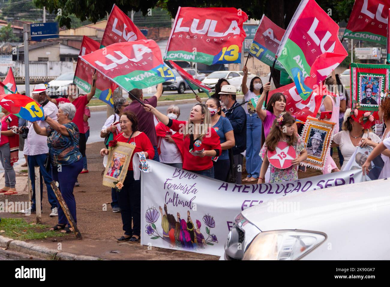 Goiânia, Goias, Brazil – October 21, 2022: Several people in action on the street with Lula's red flags. Image made in an act to ask for votes for Lul Stock Photo