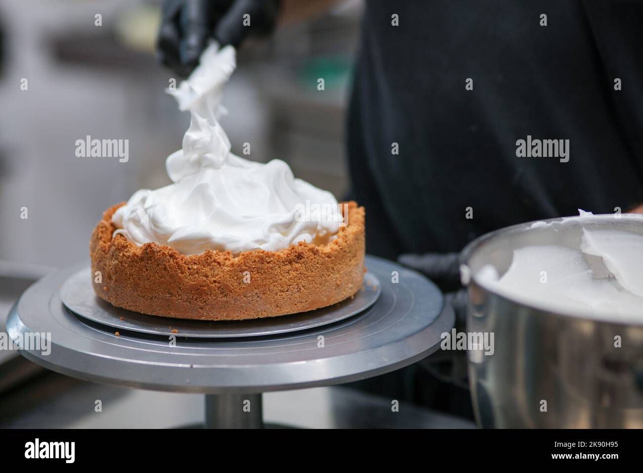 catering chef preparing key lime pie in pro kitchen Stock Photo