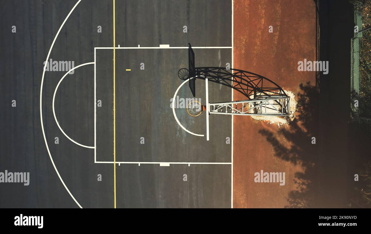 Aerial background basketball court, sports playground and outdoor community turf for competition, training and ball game. Above basketball hoop, floor Stock Photo