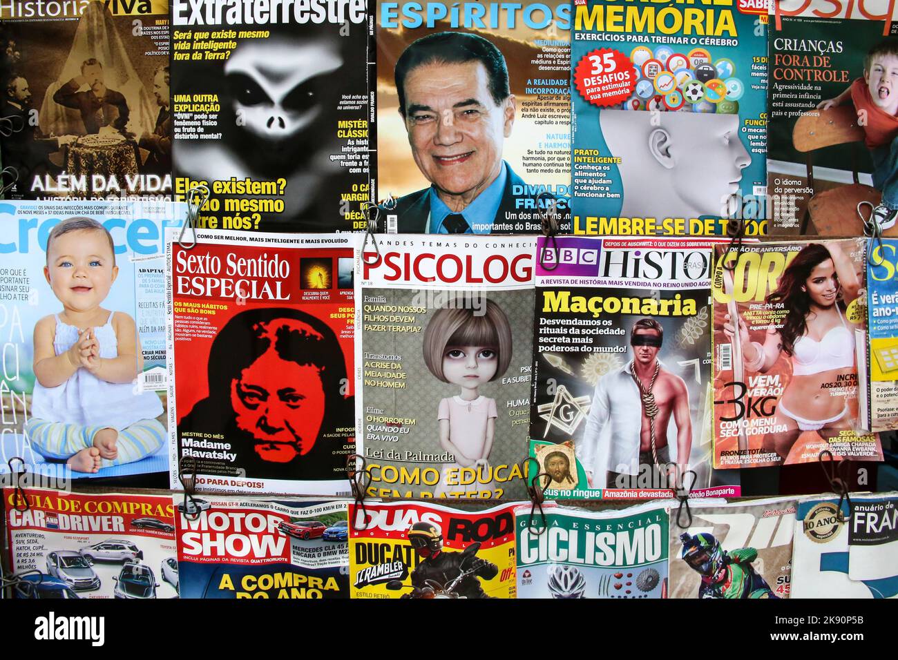 Rio de Janeiro, Brazil - January 31, 2015: titels of magazines at a kiosk in Rio. Glamor and crime is still a very potential selling issue in Newspape Stock Photo