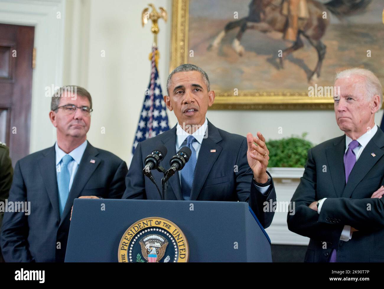 United States President Barack Obama announces he will keep 5,500 US troops in Afghanistan when he leaves office in 2017 and explains his reasoning for that action in the Roosevelt Room of the White House in Washington, DC on Thursday, October 15, 2015. Looking on are US Secretary of Defense Ashton Carter, left, and US Vice President Joe Biden, right. Credit: Ron Sachs/Pool via CNP Stock Photo