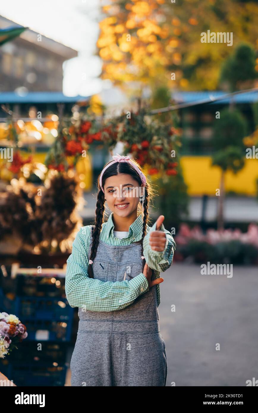 Young female farmer showing thumb hi-res stock photography and images ...